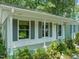 Charming home exterior featuring a covered front porch and fresh landscaping at 1317 Elmset Ln, Durham, NC 27713