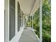The covered front porch offers a welcoming entrance with plenty of space for outdoor seating at 1317 Elmset Ln, Durham, NC 27713