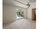 Bright living room with sliding glass doors leading to an outdoor deck at 1317 Elmset Ln, Durham, NC 27713