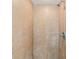 Tiled shower featuring neutral-toned tiles and a chrome showerhead at 1317 Elmset Ln, Durham, NC 27713