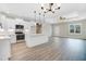 Stylish kitchen with stainless steel appliances, a kitchen island, and hardwood floors at 157 Cherrybirch Ln, Zebulon, NC 27597