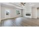 Bright living room with hardwood flooring, a fireplace, and a door leading to the outdoors at 157 Cherrybirch Ln, Zebulon, NC 27597