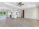 Spacious open-concept living area with hardwood floors, a view of the kitchen, and natural light at 157 Cherrybirch Ln, Zebulon, NC 27597