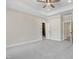 Spacious main bedroom with tray ceilings, soft carpet, and en-suite access at 157 Cherrybirch Ln, Zebulon, NC 27597