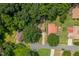 Overhead shot showcases a tranquil neighborhood, featuring tree-lined streets, and well-spaced homes at 1704 Little John Ct, Burlington, NC 27217