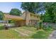 Backyard view showcasing the covered driveway and view of the deck at 1704 Little John Ct, Burlington, NC 27217