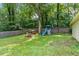Backyard view showcasing the play set with swings, slide, and playhouse for the  at 1704 Little John Ct, Burlington, NC 27217