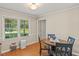 Cozy dining area featuring a window with natural light and wood-look flooring at 1704 Little John Ct, Burlington, NC 27217