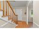 Inviting foyer with hardwood floors, a staircase with wood railings, and neutral wall colors at 1704 Little John Ct, Burlington, NC 27217