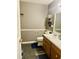 Bathroom with dual sinks and laminate flooring at 175 Ann Dr, Timberlake, NC 27583