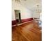 Open dining area with hardwood floors, a view to the kitchen, and a rustic light fixture at 175 Ann Dr, Timberlake, NC 27583