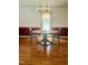 Cozy dining area featuring hardwood floors and a traditional light fixture at 175 Ann Dr, Timberlake, NC 27583