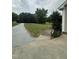 Long gravel driveway and expansive front yard showcasing the serene setting of the property at 175 Ann Dr, Timberlake, NC 27583