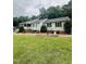 Charming home with a welcoming front porch and lush green lawn at 175 Ann Dr, Timberlake, NC 27583