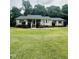 Charming single-story home with a welcoming front porch and well-manicured lawn at 175 Ann Dr, Timberlake, NC 27583