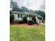 Quaint home featuring a covered front porch and lush landscaping at 175 Ann Dr, Timberlake, NC 27583