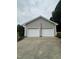 Detached two-car garage with white doors and gray siding at 175 Ann Dr, Timberlake, NC 27583