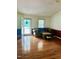Comfortable living room with hardwood floors, neutral walls, and a cozy sofa at 175 Ann Dr, Timberlake, NC 27583