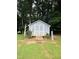 Outdoor storage shed with double doors and landscaping at 175 Ann Dr, Timberlake, NC 27583