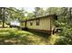 Simple home featuring a modest yard in a wooded neighborhood at 181 Mangums Dr, Wendell, NC 27591