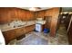 Modest kitchen with vintage cabinets, complete with a ceiling fan and a classic sink at 181 Mangums Dr, Wendell, NC 27591