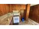 Cozy kitchen with laminate countertops, white appliances and wooden cabinets at 181 Mangums Dr, Wendell, NC 27591