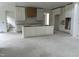 Kitchen under construction featuring white cabinets and a central island ready for customization at 200 Meadow Walk Dr, Fuquay Varina, NC 27526
