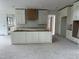 Bright, spacious kitchen featuring white cabinets, a large center island, and a decorative wood vent hood at 200 Meadow Walk Dr, Fuquay Varina, NC 27526