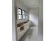 New kitchen being built with white cabinets, brass hardware, and bright natural lighting at 200 Meadow Walk Dr, Fuquay Varina, NC 27526