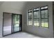 Bright, airy living area features a sliding door and multiple windows for abundant natural light at 200 Meadow Walk Dr, Fuquay Varina, NC 27526