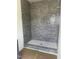 New shower features attractive tile and flooring at 200 Meadow Walk Dr, Fuquay Varina, NC 27526