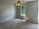 A bedroom with neutral carpeting and ceiling fan at 2012 Ranch Mill Cir, Raleigh, NC 27610