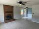A living room showing the brick fireplace and adjoining dining area at 2012 Ranch Mill Cir, Raleigh, NC 27610