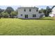 Large backyard and exterior view of home with green grass at 211 Cloverdale Dr, Durham, NC 27703