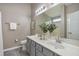 Bathroom featuring large mirror, double sinks, and modern vanity at 211 Cloverdale Dr, Durham, NC 27703