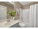 Neutral bathroom featuring large mirror, modern vanity, and shower with curtain at 211 Cloverdale Dr, Durham, NC 27703