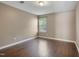 A cozy bedroom with hardwood floors and a window allowing natural light in at 211 Cloverdale Dr, Durham, NC 27703
