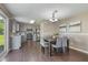 Charming dining area featuring wood floors, neutral walls, and a view of the kitchen and backyard at 211 Cloverdale Dr, Durham, NC 27703