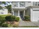 A welcoming front porch features a lovely entrance with neat landscaping and ample natural light at 211 Cloverdale Dr, Durham, NC 27703
