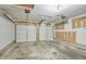 Two-car garage with garage door openers and concrete floors at 211 Cloverdale Dr, Durham, NC 27703