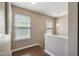 Upstairs hallway with two windows providing ample natural light at 211 Cloverdale Dr, Durham, NC 27703