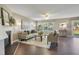 Bright living room with modern decor, large windows, and sliding doors to the backyard at 211 Cloverdale Dr, Durham, NC 27703