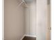 Walk-in closet with white wire shelving and neutral walls at 211 Cloverdale Dr, Durham, NC 27703