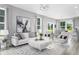 Bright and stylish living room with white sofa, decor, lots of natural light, and open floor plan at 219 Faith Avenue, Sanford, NC 27330
