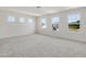 Bright bedroom boasts 3 windows and neutral paint, awaiting its new owner's design at 227 Faith Avenue, Sanford, NC 27330