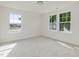 Bright, carpeted bedroom with ample natural light at 227 Faith Avenue, Sanford, NC 27330