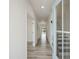 Bright foyer with luxury vinyl plank flooring, white walls, and a staircase at 227 Faith Avenue, Sanford, NC 27330