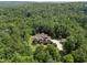 Expansive property with lush trees, a well-manicured lawn, and private driveway viewed from above at 267 Bald Eagle Dr, Pittsboro, NC 27312