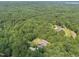 Lovely estate is nestled among a forest of mature hardwoods in a desirable community at 267 Bald Eagle Dr, Pittsboro, NC 27312