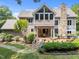 Expansive backyard featuring a large deck, stone fireplace, and lush greenery for outdoor living at 267 Bald Eagle Dr, Pittsboro, NC 27312